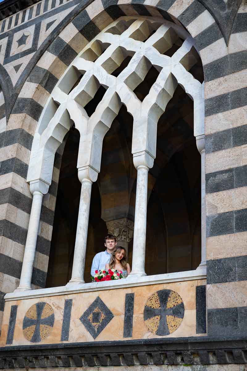 Standing on the window looking outwards while subject of different pictures being taken 