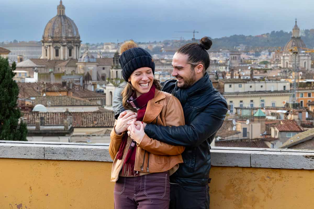 Dun and lively pictures taken on a rooftop terrace that overlooks the roman skyline above as the ultimate photoshoot in Rome