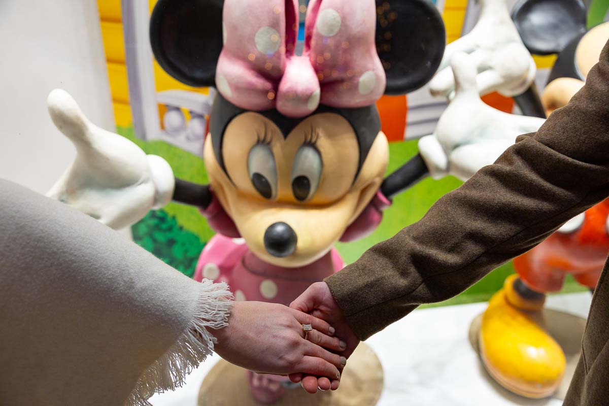 Engagement ring photography during a photo session in front of minni creative engaged photos 