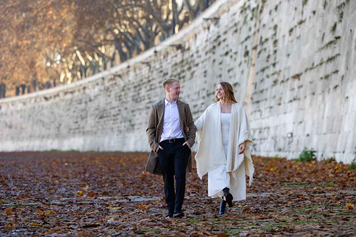 Cinematic couple Walking hand in hand on a bed of autumn leaves ground photography shoot Photoshoot in Rome