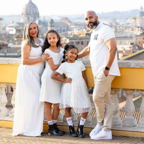 Photo session on Capitoline Hill with the Eternal City skyline and historic domes stretching across the background. Rome Family Portraits series