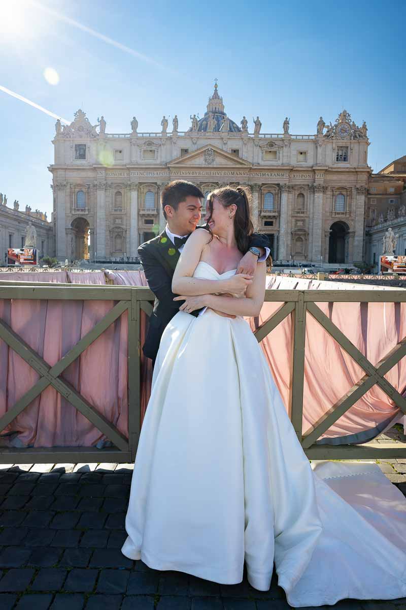 Professional wedding photography session taking place underneath the majestic Saint Peter’s Basilica.