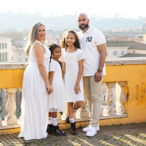 Photo taken from a terrace viewpoint with panoramic skyline views across the Eternal City