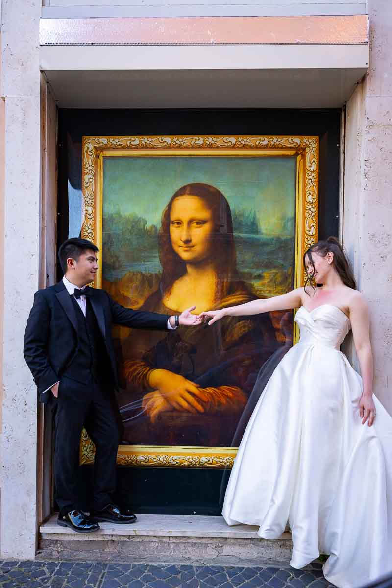Romantic pose with a Monalisa smile as the newlyweds hold hands in Rome.