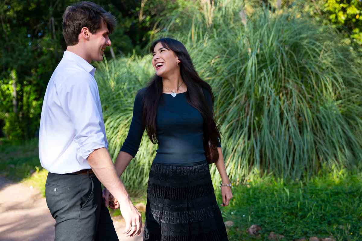 Walking together as just engaged couple in the park 