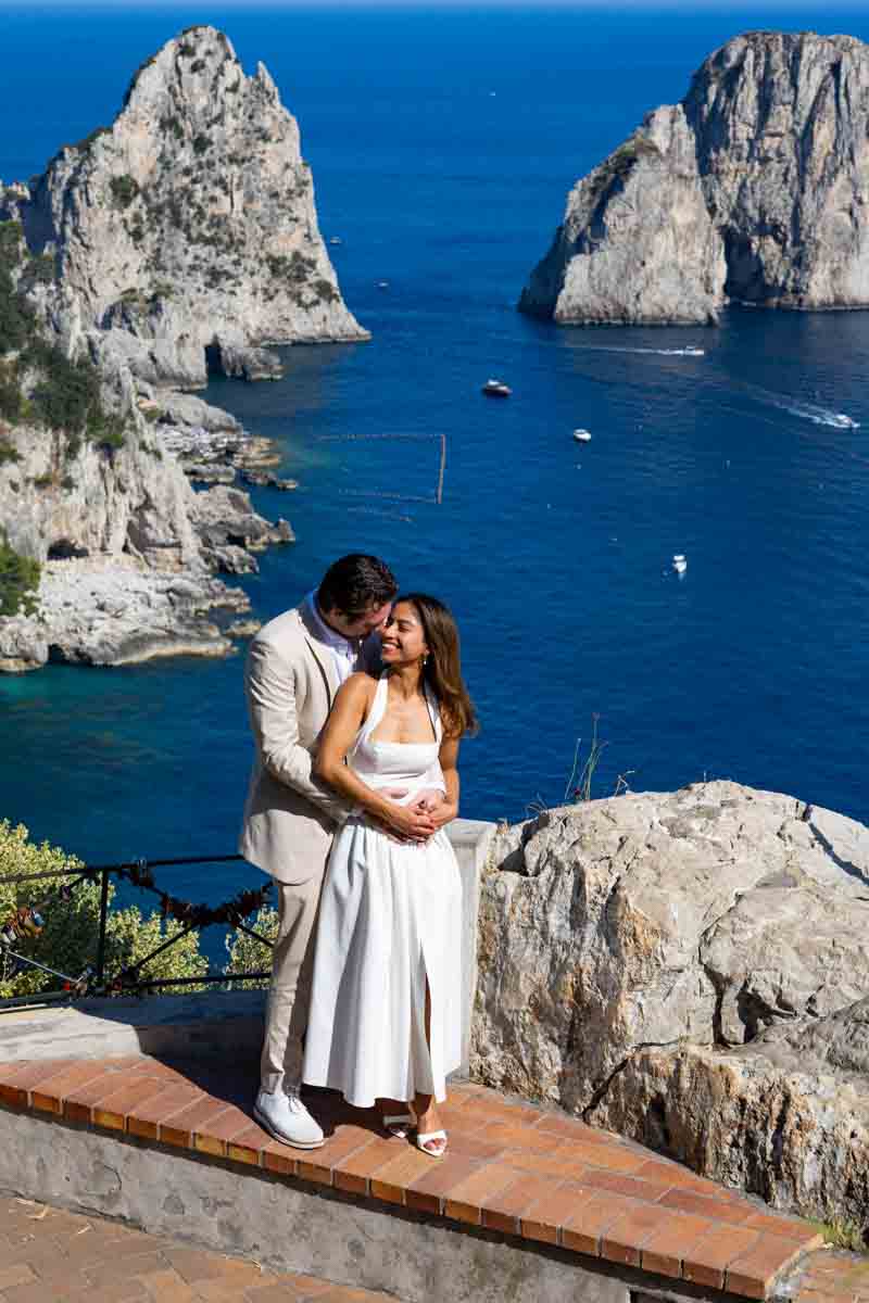 Standing posing in love while on a photo shoot overlooking the Mediterranean sea 