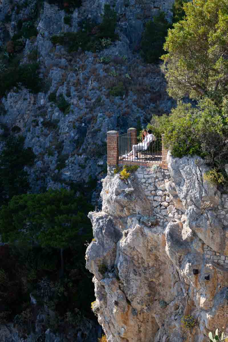Sitting down on a bench admiring the cliff view 