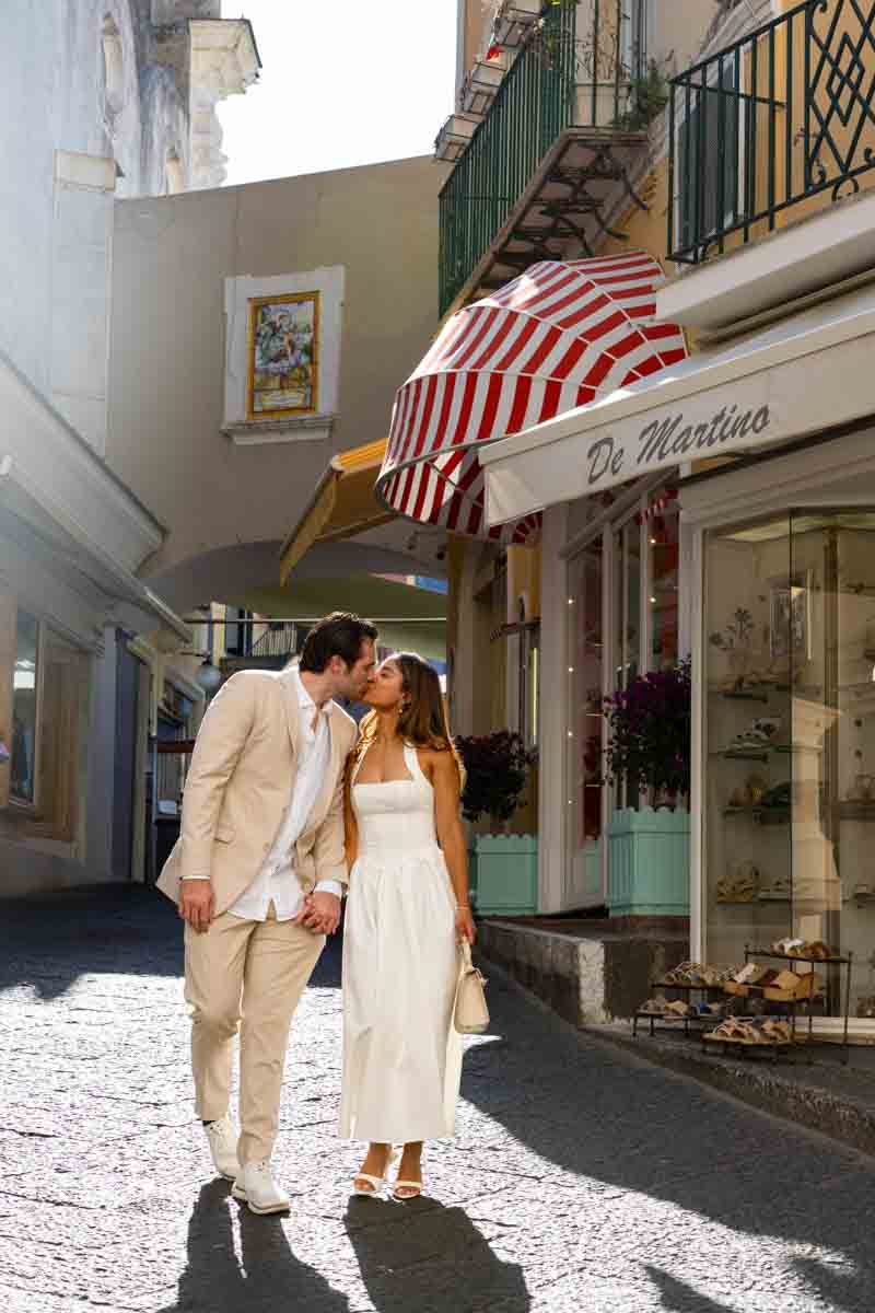 Walking together holding hands in the streets of Capri town alleyways 