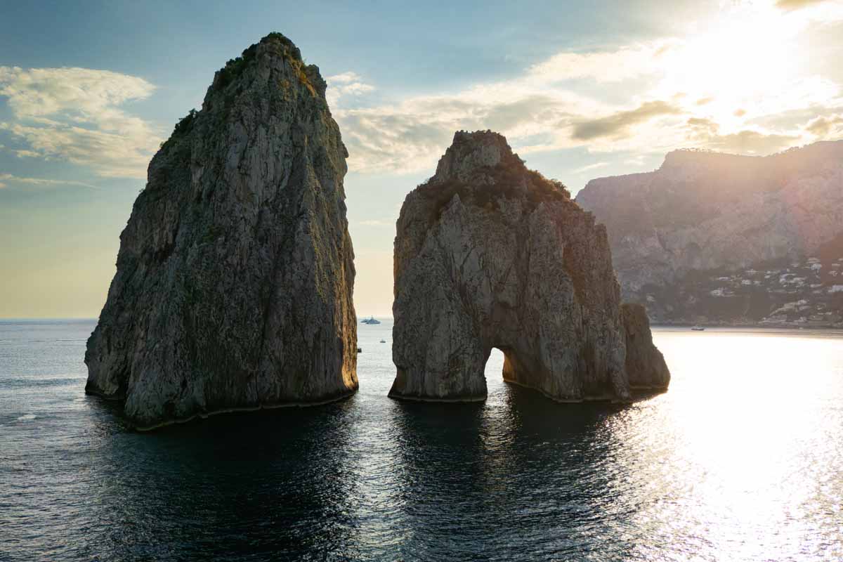 Drone image of the faraglioni rocks seen from the sky. birds eye view 
