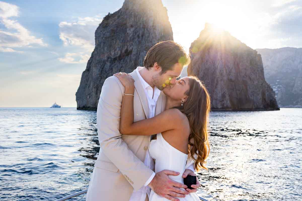 Kissing in love over the sea in Italy 