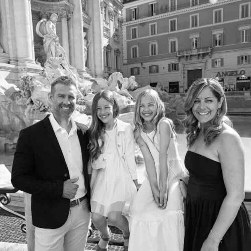 Black and white image. Group photography. Touring the roman city by van. Taking unique and creative pictures together