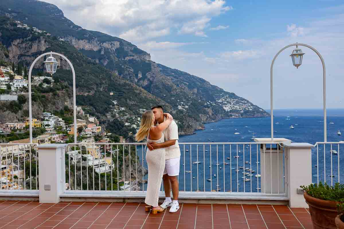 Final portrait picture taken on the private terrace overlooking the coastline from way above as part of unique and creative photographer session in Italy
