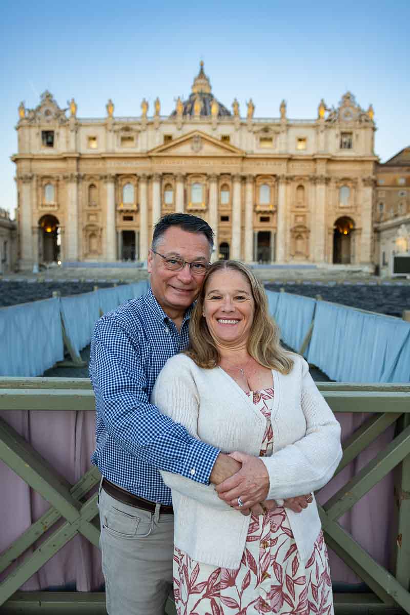 Vatican anniversary photography capturing a portrait of a couple outdoor in front of the majestic Saint Peter's Basilica facade