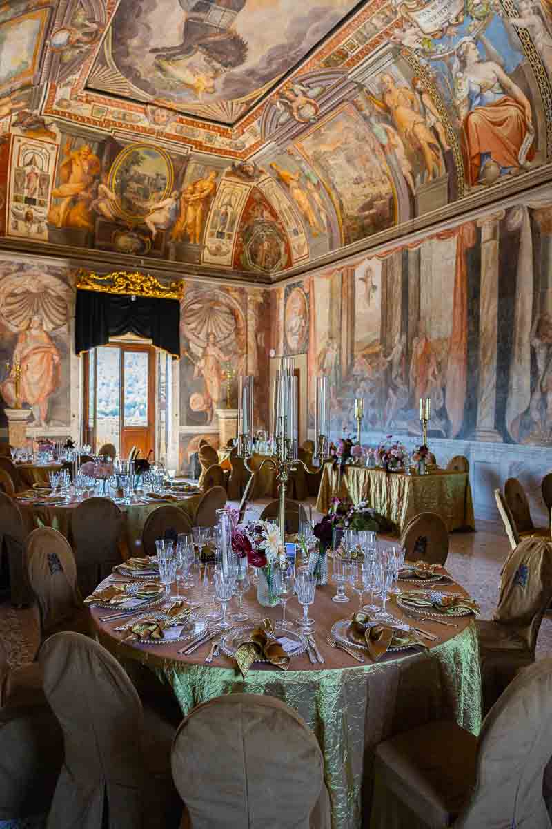 The grand indoor banqueting hall meticulously set up for a luxury dinner reception.
