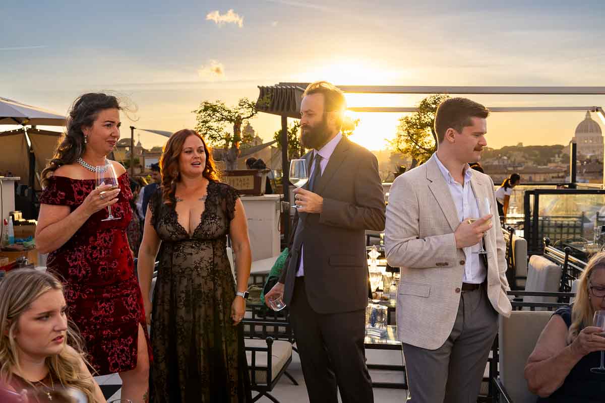 An elevated view of the dinner party welcoming guests as the sun begins to set.