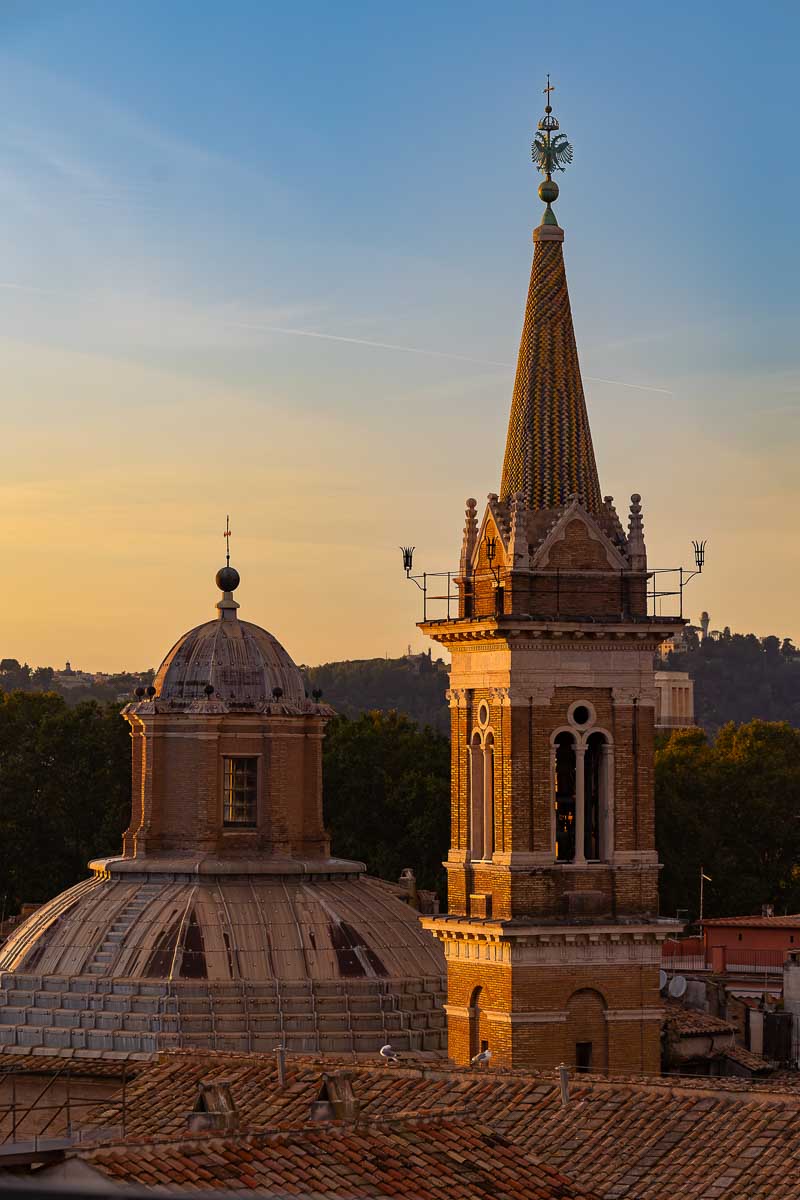 The beautiful historic Roman skyline fading from golden hour into twilight.