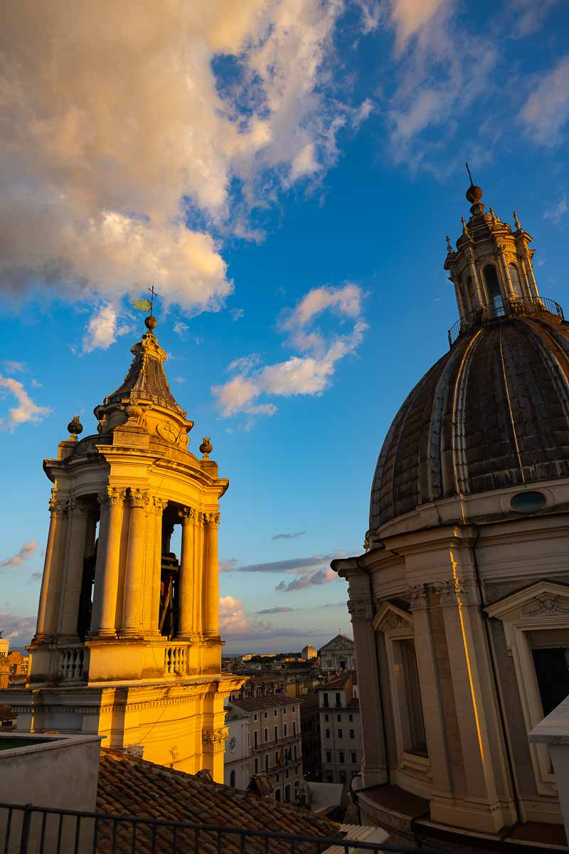 A detailed architectural view of the church dome and tower of Sant'Agnese in Agone.