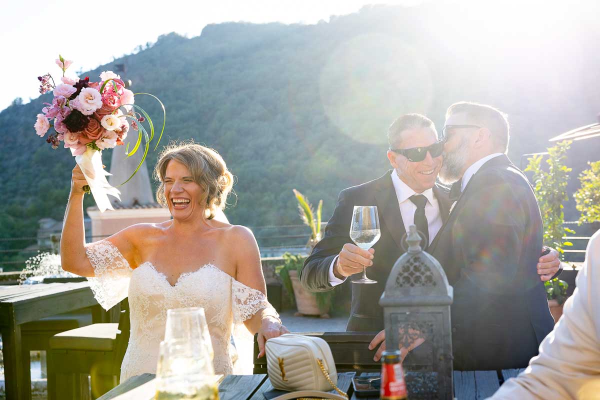 Atmospheric reception photography showcasing the relaxed flow of the outdoor cocktail party.