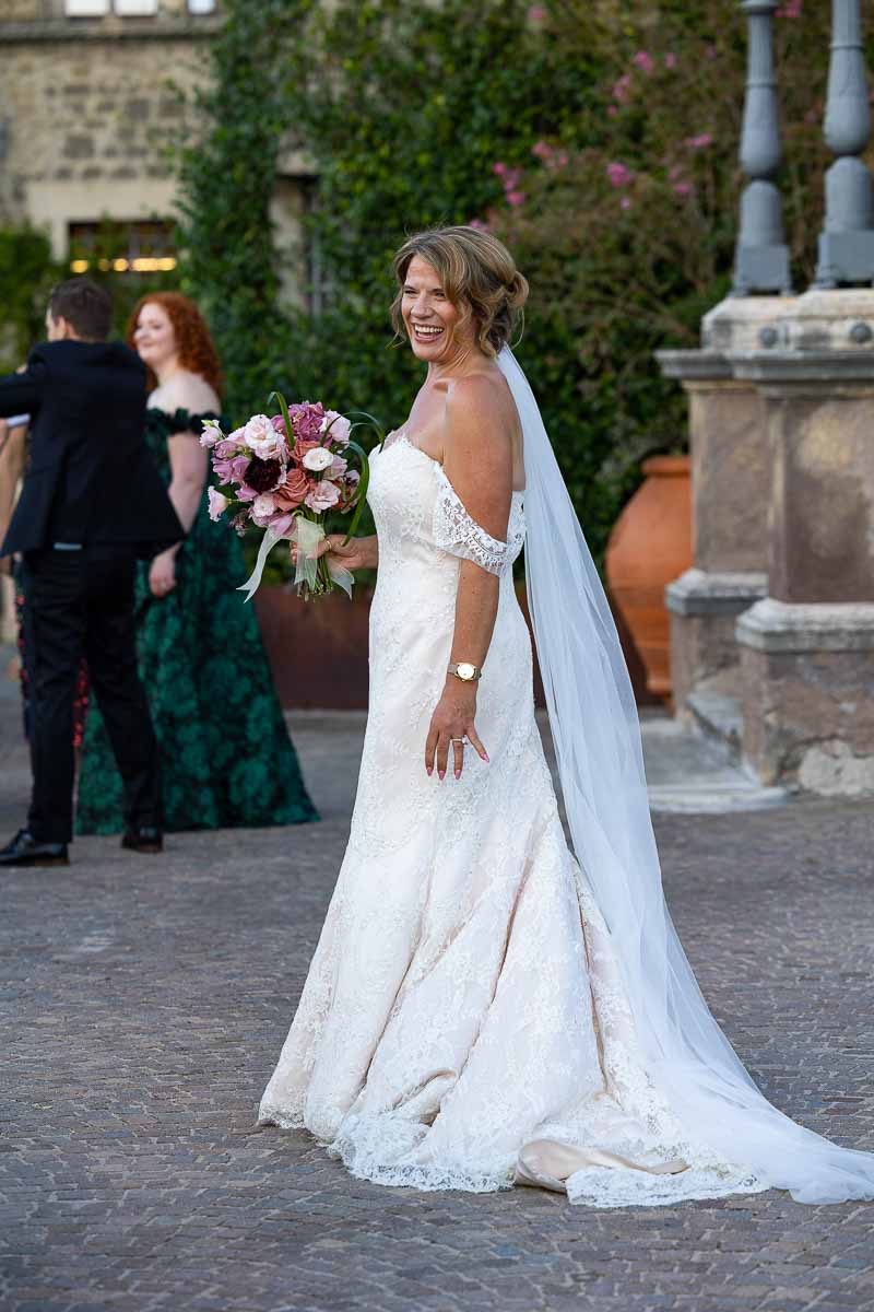 A stunning, natural light bridal portrait showcasing the intricate veil details.