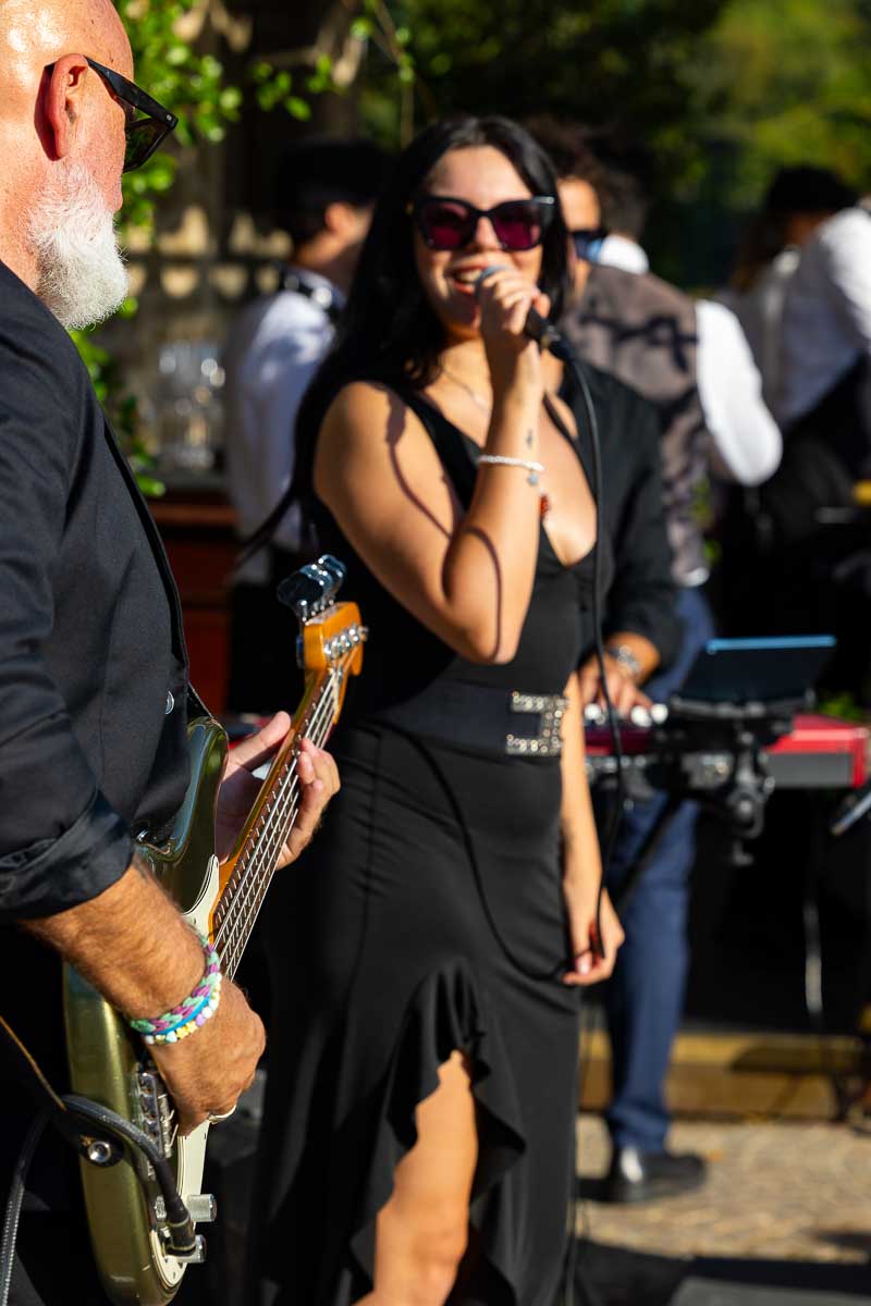 A close-up portrait of the talented live band singer performing during the reception.