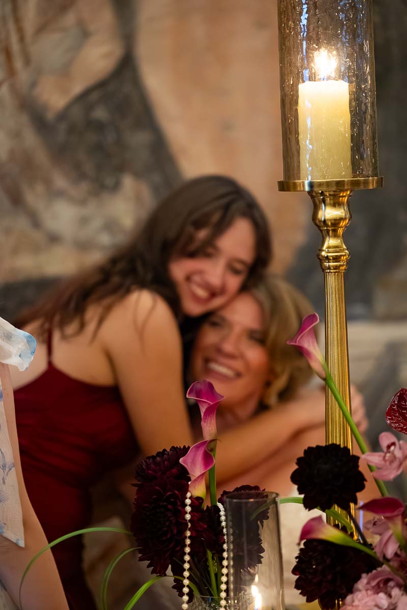 Warm embraces and happy smiles shared between friends during the afternoon celebrations.