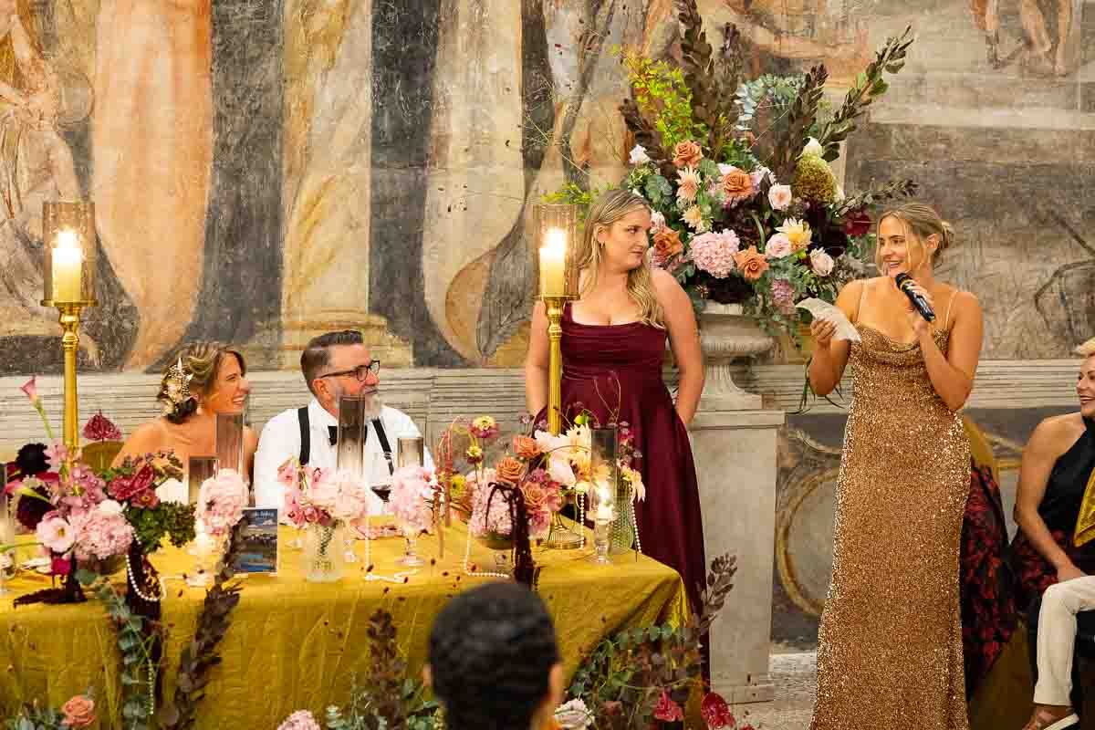 Delivering an emotional speech to the seated guests. Telephoto image taken from a distance