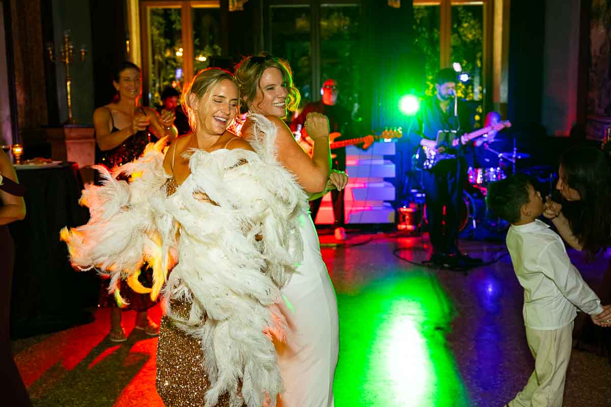 Guests raising their hands and enjoying the fast-paced tempo of the live music set.
