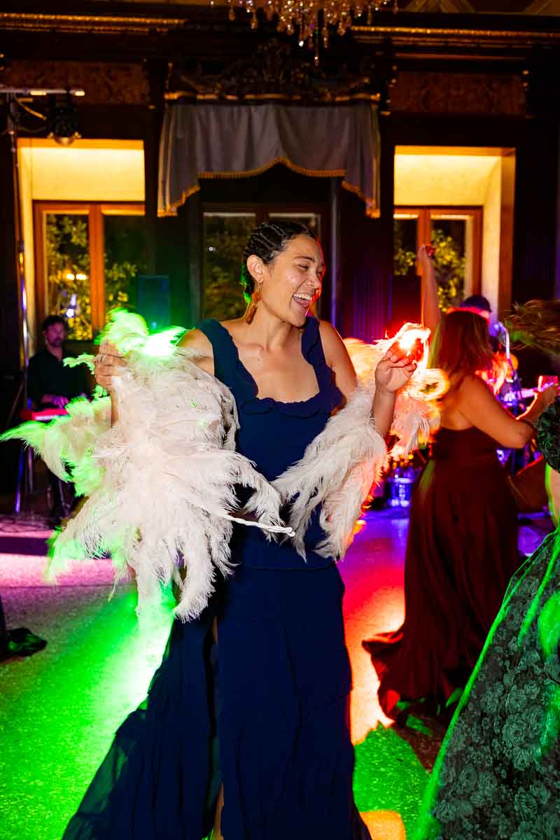Atmospheric evening party coverage showing continuous movement and celebratory fun.