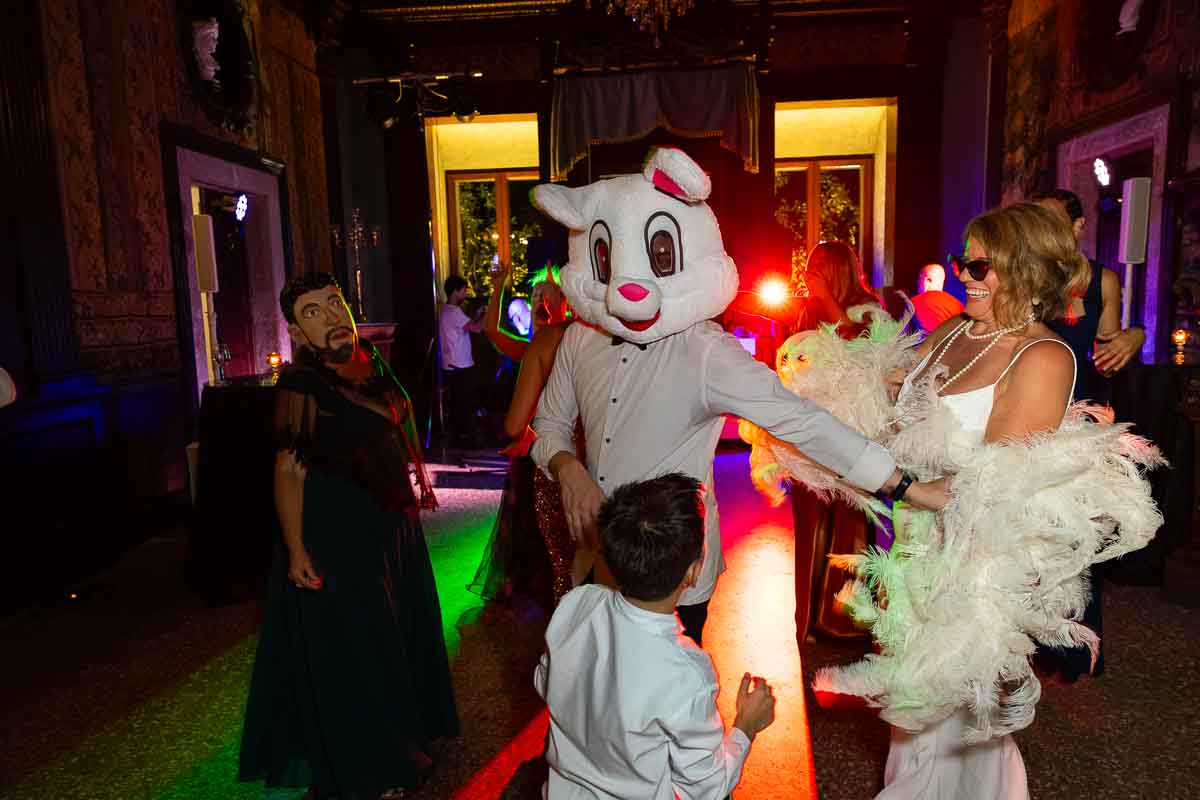 The newlyweds sharing a fun, fast-paced dance moment surrounded by their favorite people.